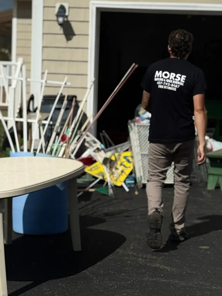 Morse Hauling & Junk Removal crew member during a residential garage cleanout in Elmira, NY