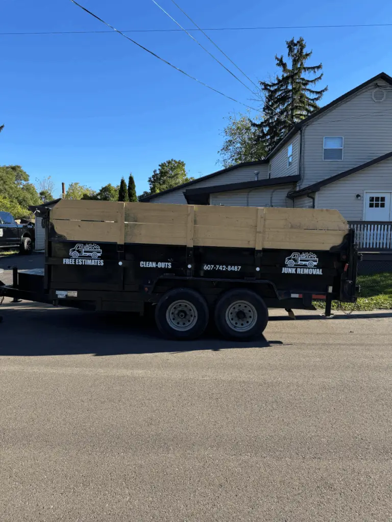 Morse Hauling & Junk Removal trailer staged for curbside junk pickup in Elmira, NY