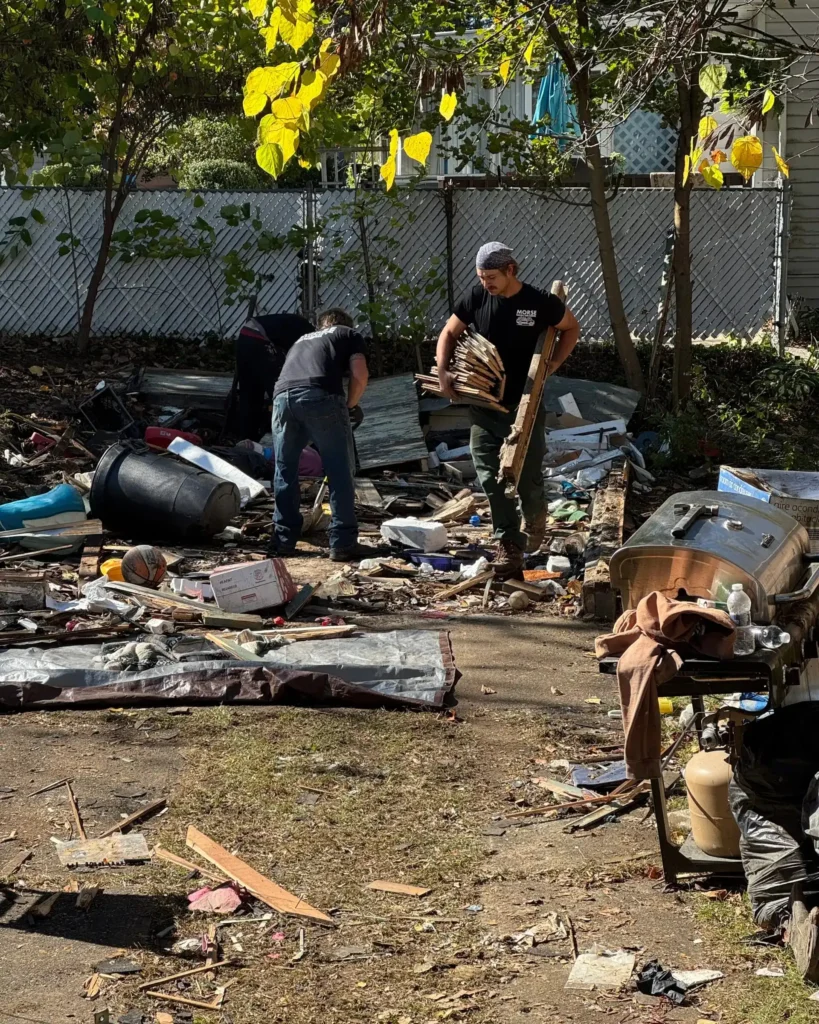 Morse Hauling & Junk Removal crew clearing demolition debris during a property cleanout in Elmira, NY