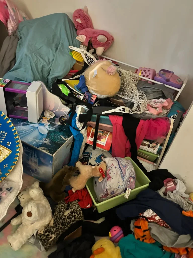 Cluttered child’s bedroom during a full clean out in Elmira, NY.