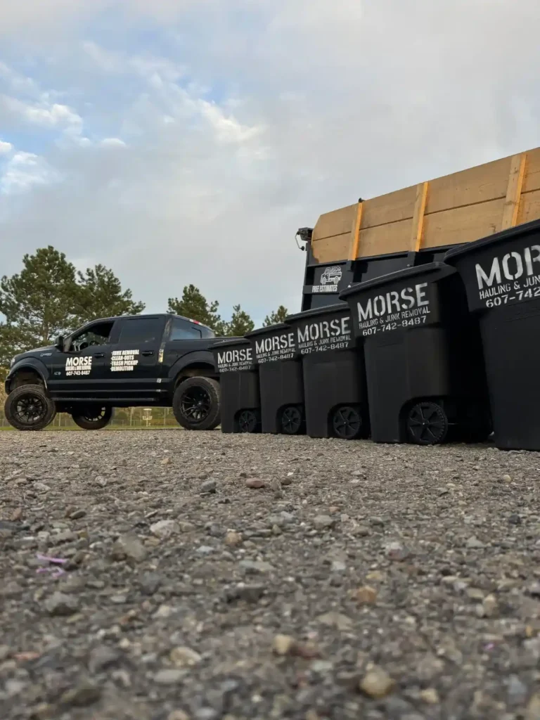 Morse Hauling & Junk Removal truck, trailer, and trash bins set up for weekly trash pickup service in Elmira, NY.