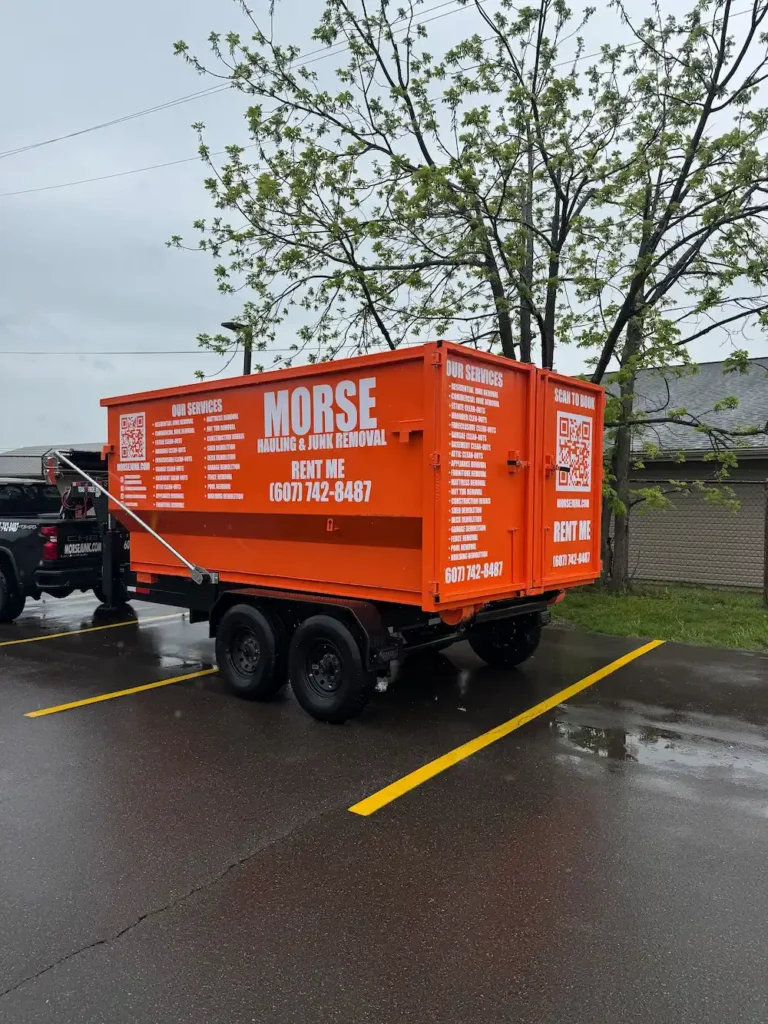 Morse Hauling 21-yard roll-off dumpster rental on trailer, ready for delivery in Horseheads, NY.